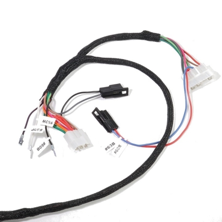 A section of the harness with black loom and sever multi-colored wires leading to various connectors.