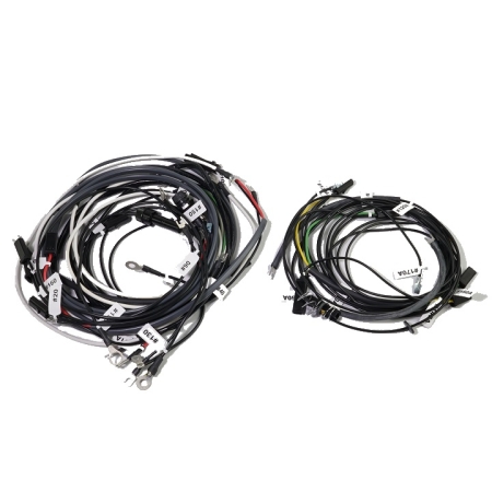 Two sets of wires coiled next to each other against a white background.