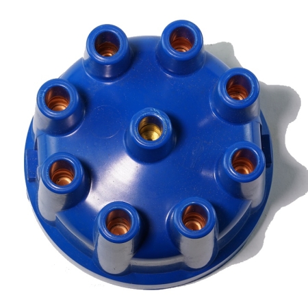 A top-down view of a blue 8-cylinder distributor cap. The copper contacts in the cap are visible.
