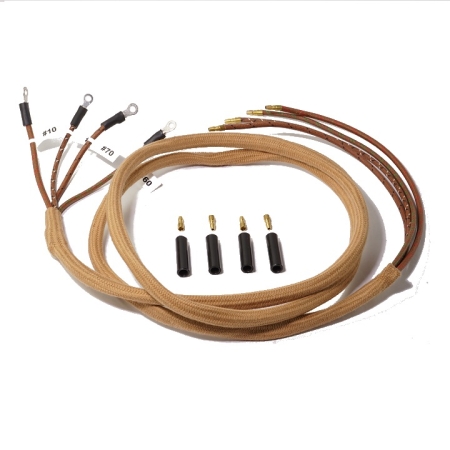 A brown wire harness with 4 wires in at as well as 4 loose bullet terminals and bullet connectors.