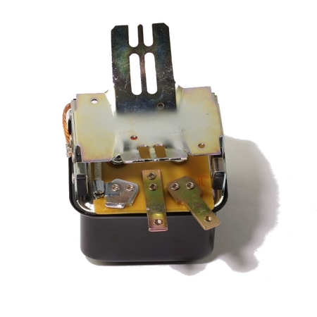 A voltage regulator on its back.